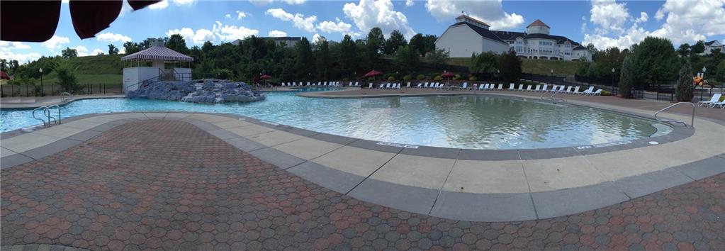242 Adams Pointe Boulevard, Unit 3 Mars, PA 16046 - Photo 17 of 19 a view of a fountain with a house in the background