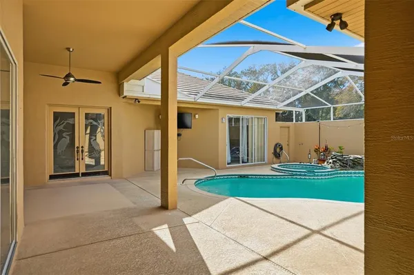a view of a house with backyard and porch
