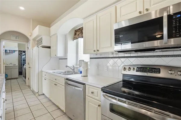 a kitchen with a stove and a microwave