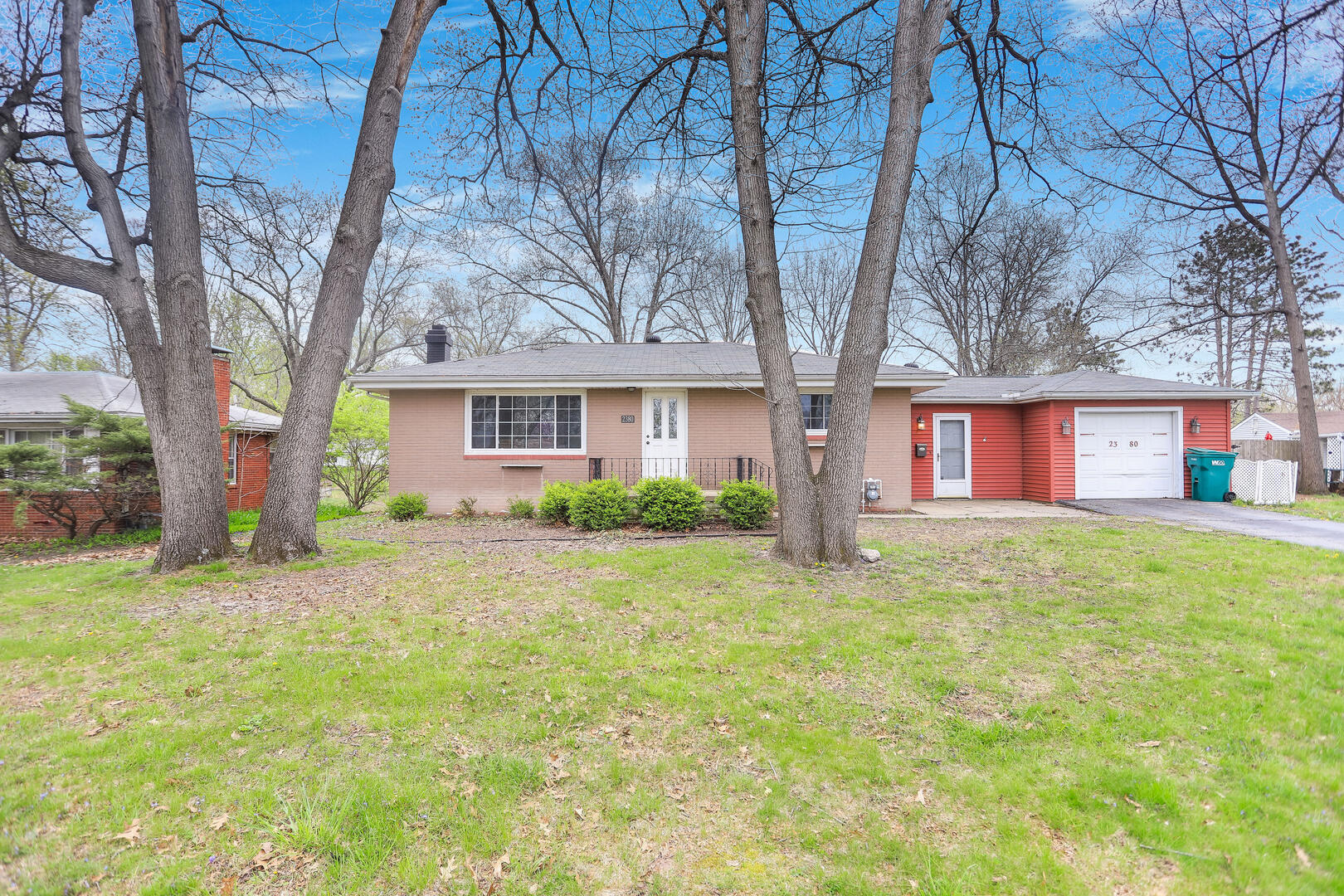 2380 Windsor Road Decatur, IL 62521 - Photo 1 of 27 a front view of a house with a garden