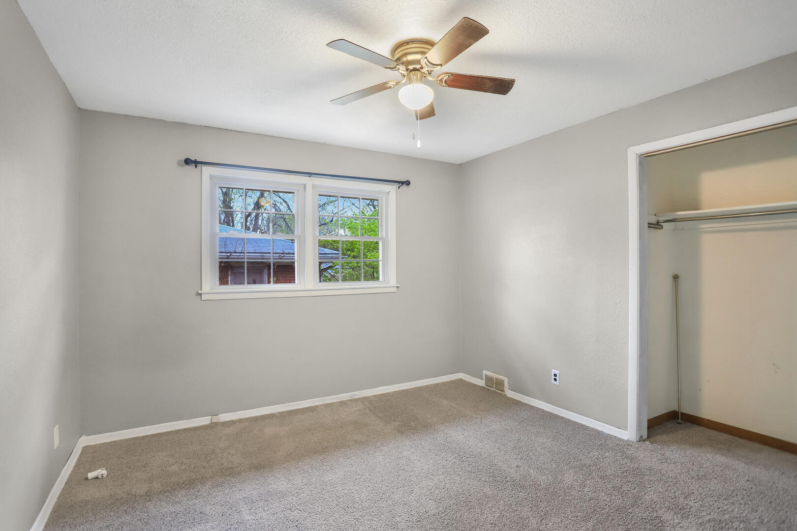 2380 Windsor Road Decatur, IL 62521 - Photo 12 of 27 an empty room with a window and a fan