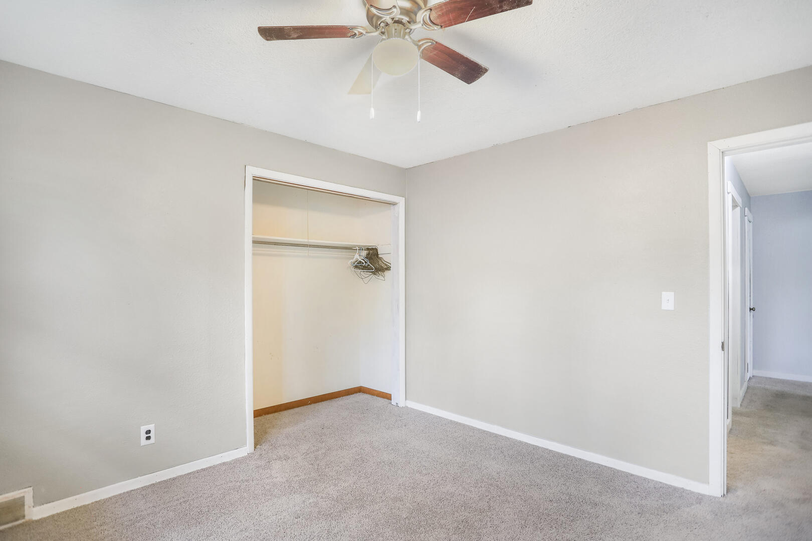 2380 Windsor Road Decatur, IL 62521 - Photo 13 of 27 an empty room with a ceiling fan and a window