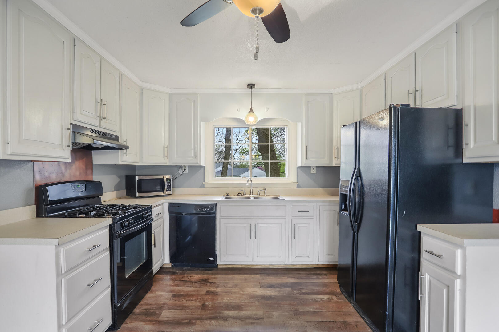 2380 Windsor Road Decatur, IL 62521 - Photo 7 of 27 a kitchen with a refrigerator sink and stove