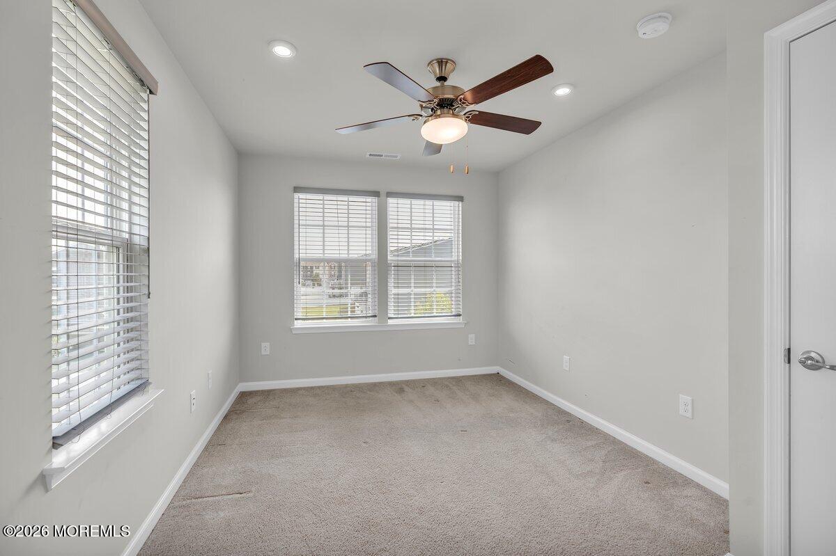 411 Sammy Street Swedesboro, NJ 08085 - Photo 12 of 24 a view of an empty room with a window