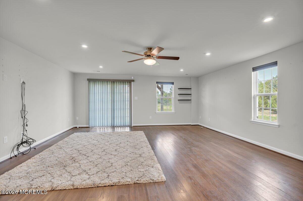411 Sammy Street Swedesboro, NJ 08085 - Photo 18 of 24 wooden floor in an empty room with a window