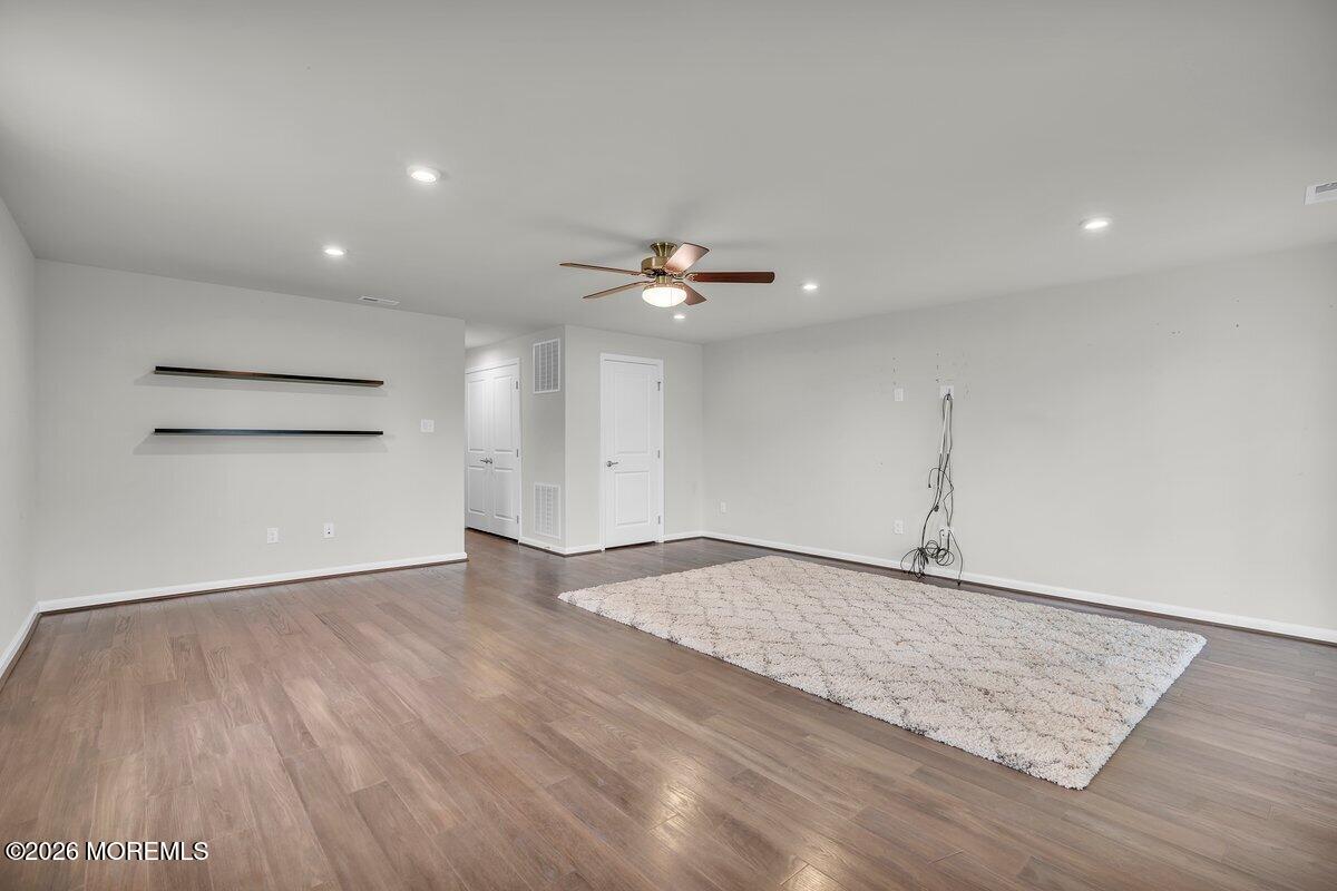 411 Sammy Street Swedesboro, NJ 08085 - Photo 19 of 24 wooden floor in an empty room with a window