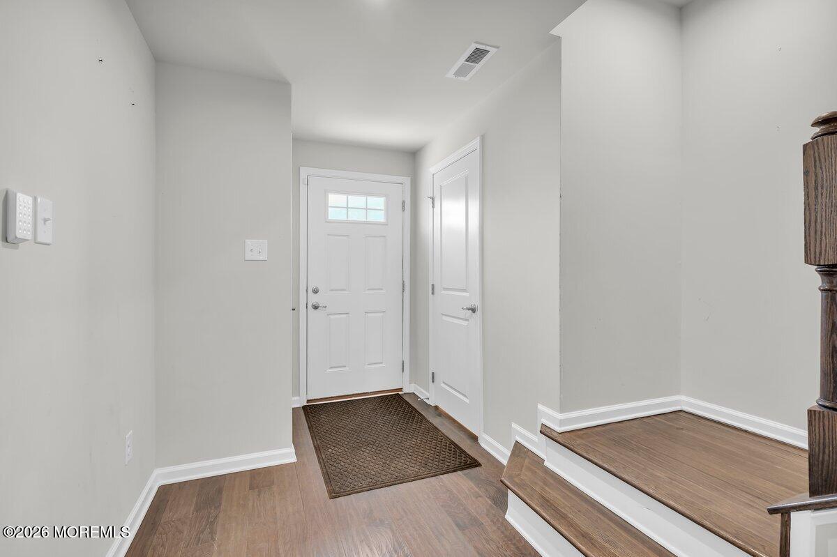 411 Sammy Street Swedesboro, NJ 08085 - Photo 4 of 24 an empty room with wooden floor