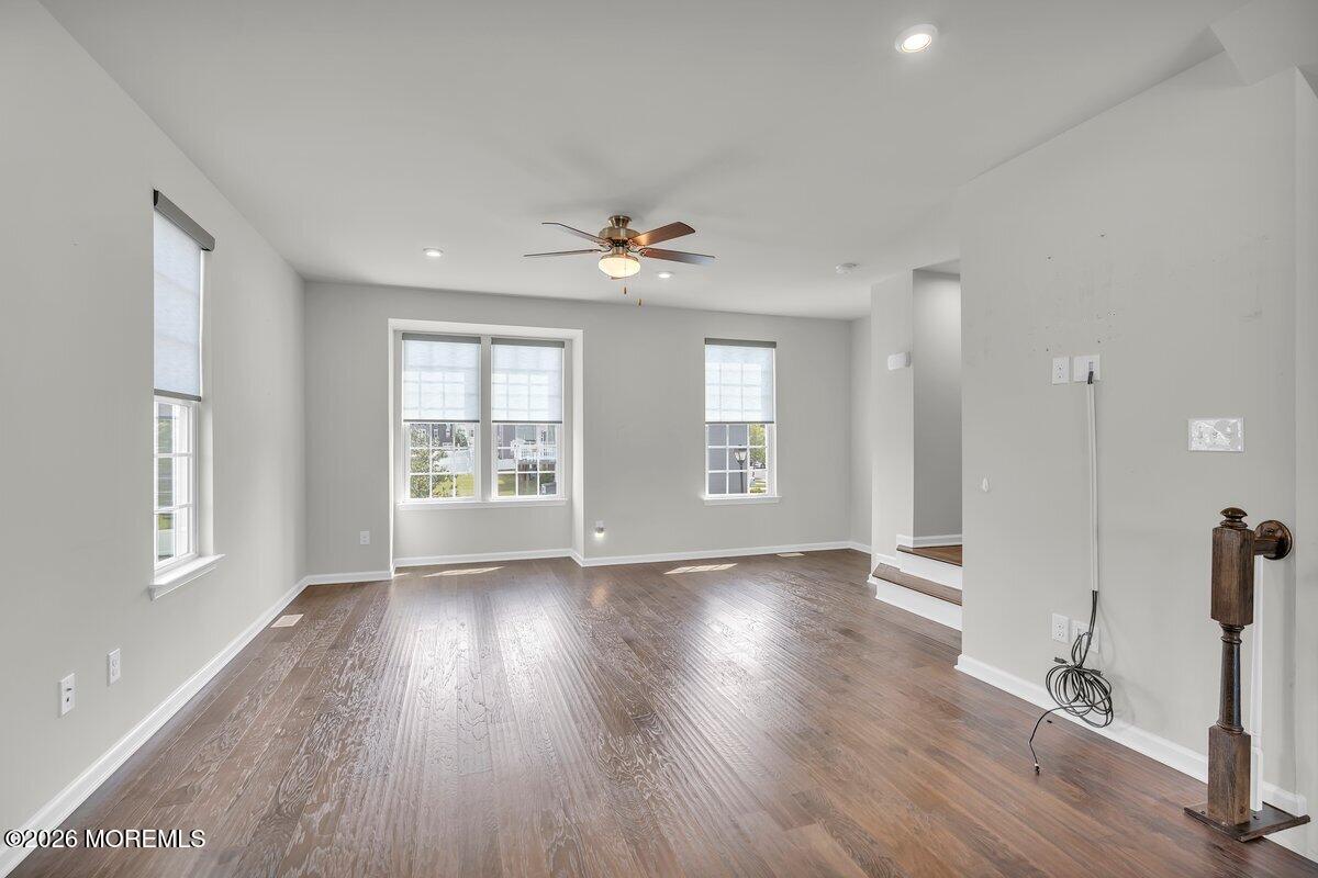411 Sammy Street Swedesboro, NJ 08085 - Photo 5 of 24 a view of an empty room with a window and wooden floor