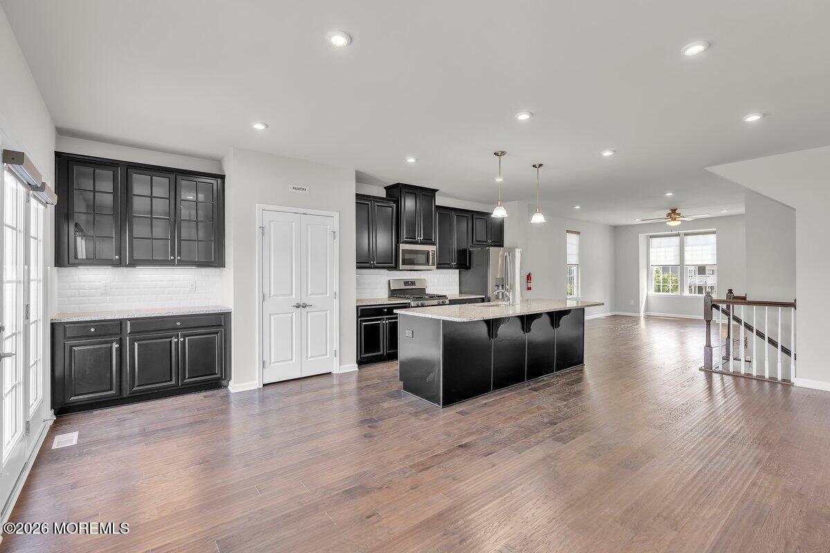 411 Sammy Street Swedesboro, NJ 08085 - Photo 7 of 24 a large kitchen with stainless steel appliances granite countertop a large counter top a stove a sink and a refrigerator