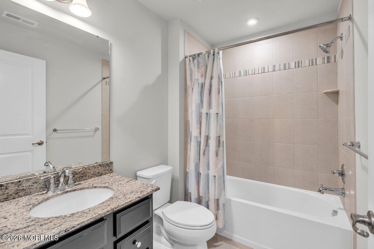 411 Sammy Street Swedesboro, NJ 08085 - Photo 10 of 24 a bathroom with a granite countertop sink toilet and shower