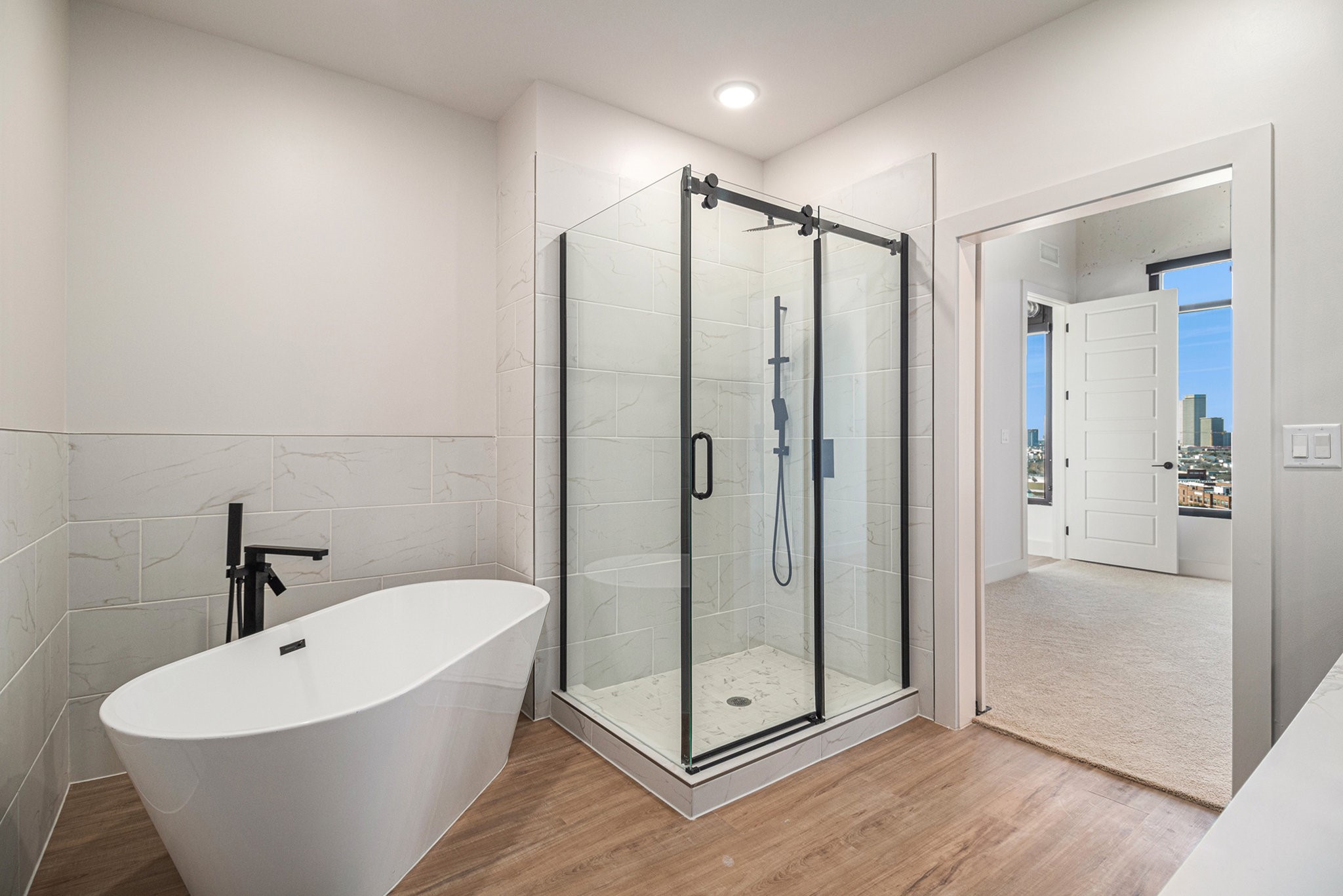 1801 Smith Street, Unit 1814 Houston, TX 77002 - Photo 11 of 24 a bathroom with a bathtub and shower