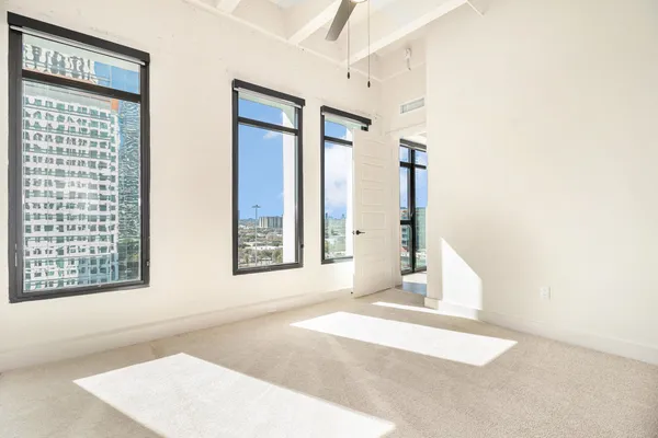 a view of an empty room with a window