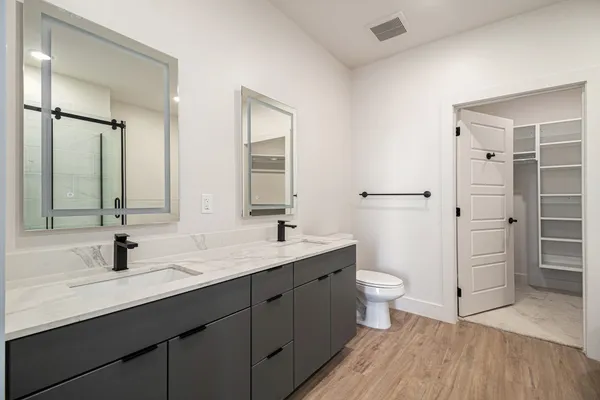 a bathroom with a bathtub and shower