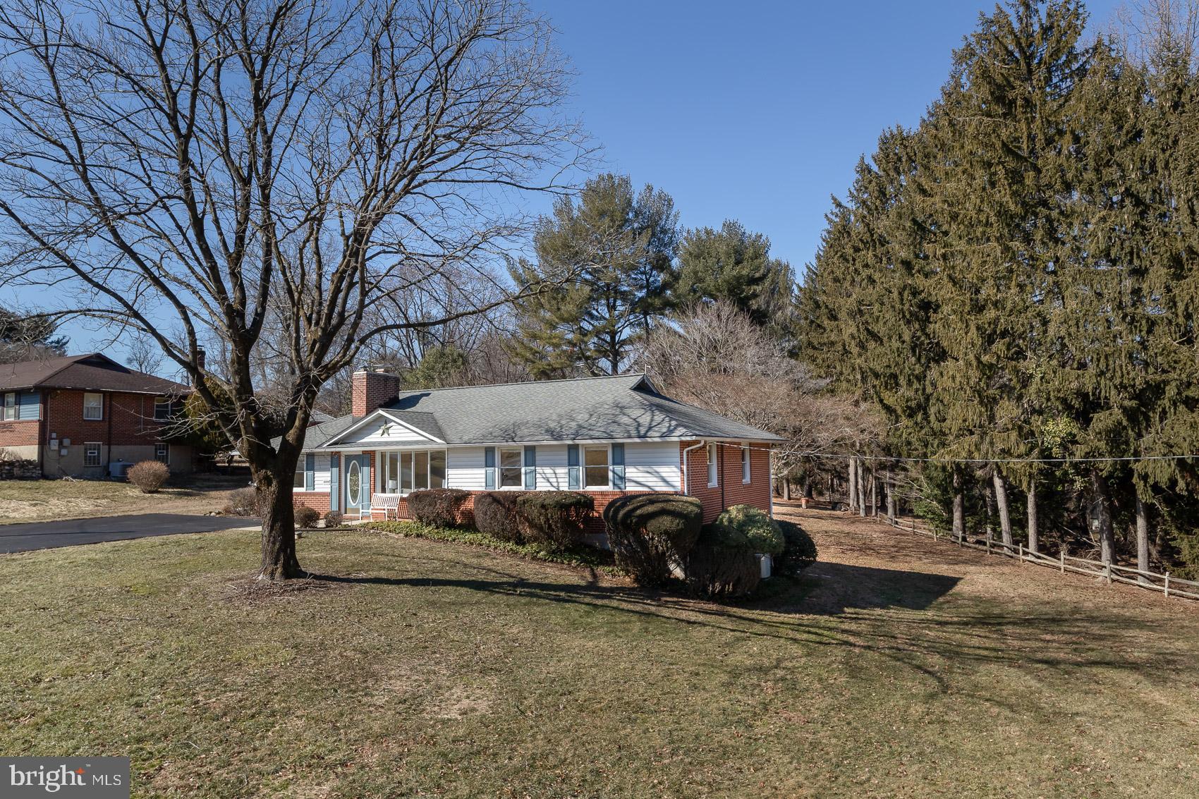 2308 Carlo Road Fallston, MD 21047 - Photo 50 of 53 a front view of a house with a yard and large trees