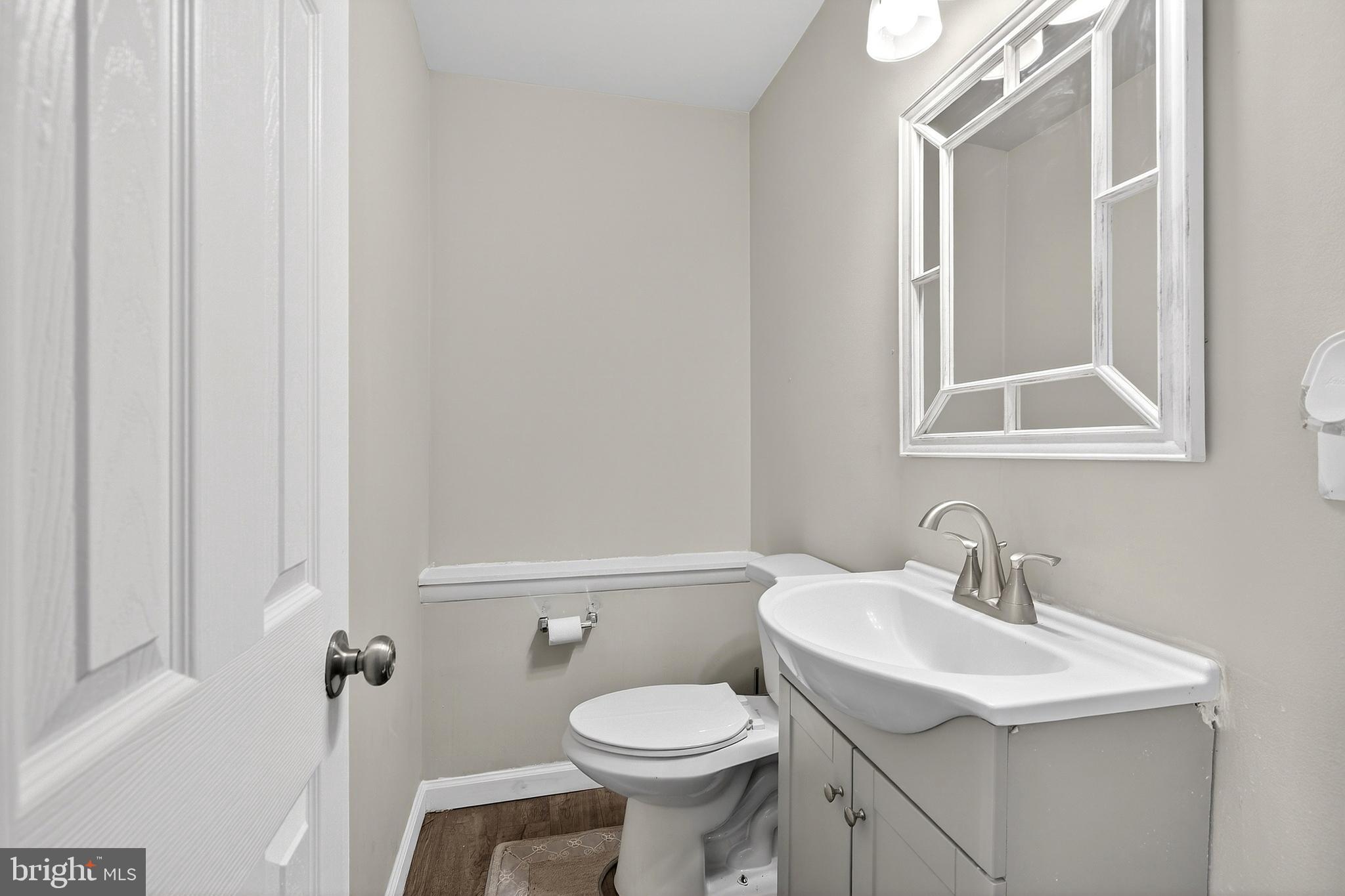 7 Gull Turn Newark, DE 19702 - Photo 15 of 29 a bathroom with a toilet sink and mirror