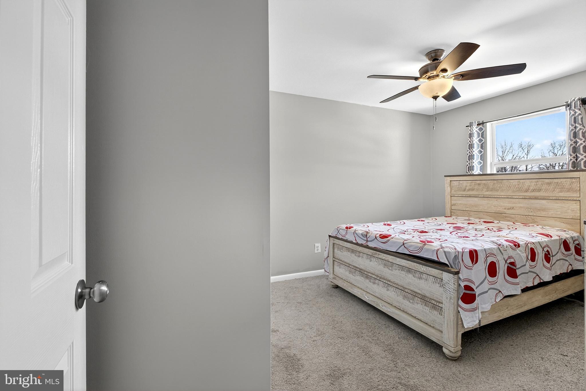 7 Gull Turn Newark, DE 19702 - Photo 21 of 29 a bedroom with a bed and ceiling fan