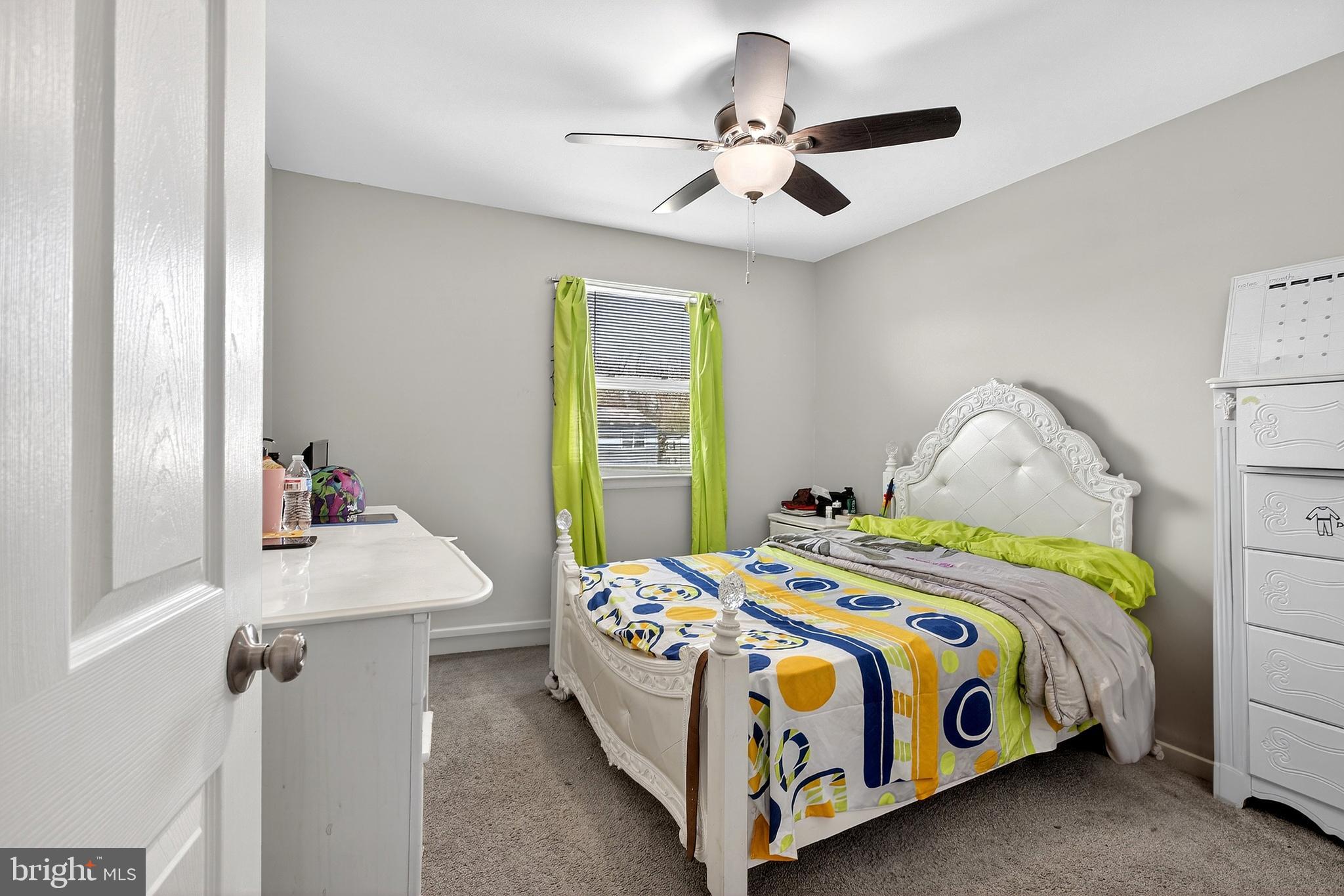 7 Gull Turn Newark, DE 19702 - Photo 24 of 29 a bedroom with a bed and a chandelier