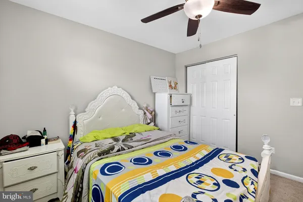 a bedroom with a bed and a dresser