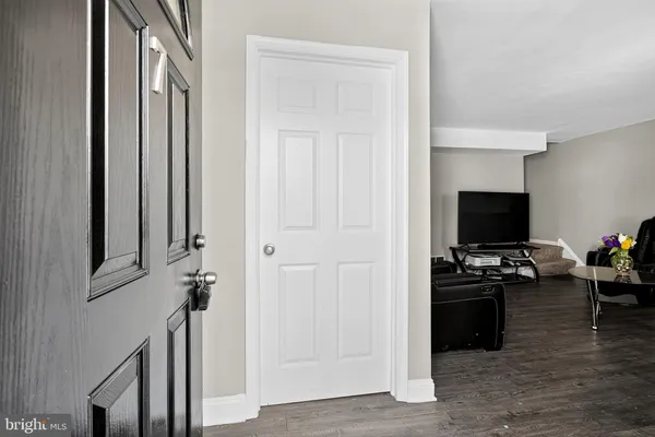 a view of a livingroom with a kitchen