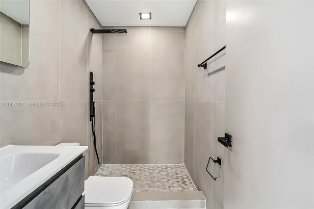 a bathroom with a sink a toilet and a bathtub