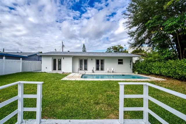 a backyard of a house with lots of green space