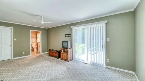 a view of room with furniture and windows