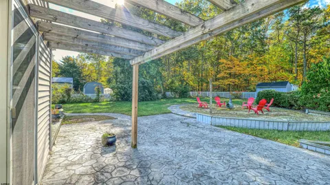 a view of yard with swimming pool
