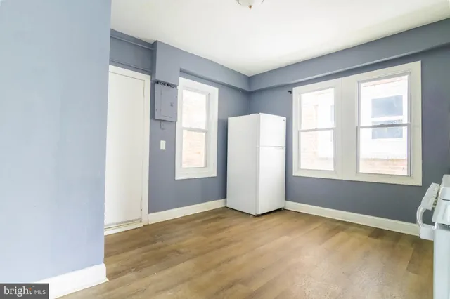 a kitchen with a stove a sink and a window