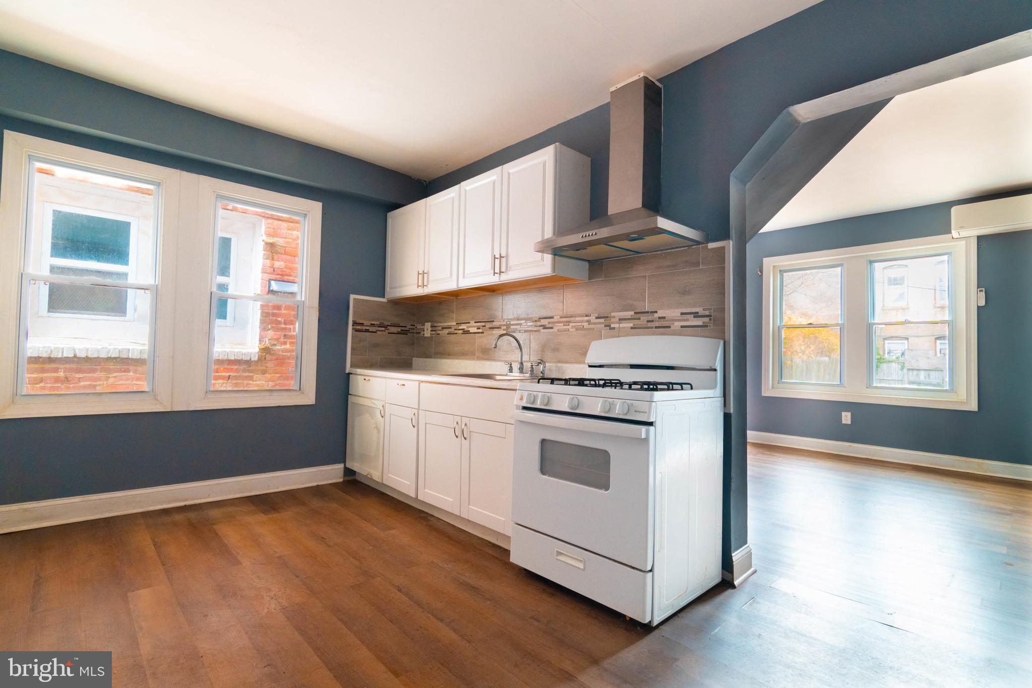 2506 Tindaro Terrace Atlantic City, NJ 08401 - Photo 3 of 14 a kitchen with a stove a sink and a window