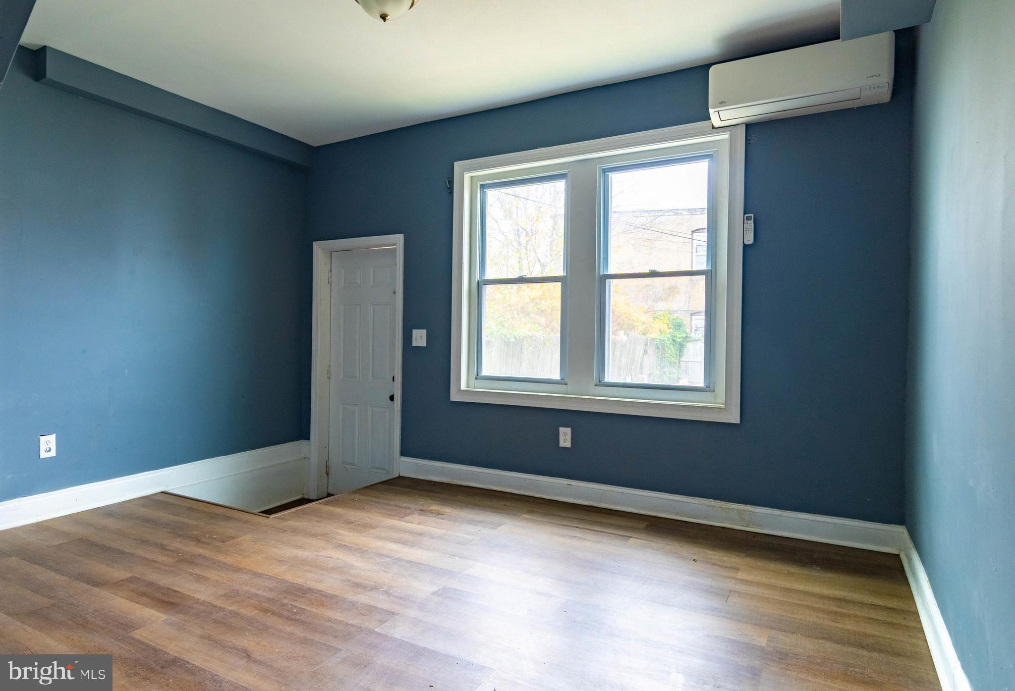 2506 Tindaro Terrace Atlantic City, NJ 08401 - Photo 4 of 14 a view of an empty room with wooden floor and a window