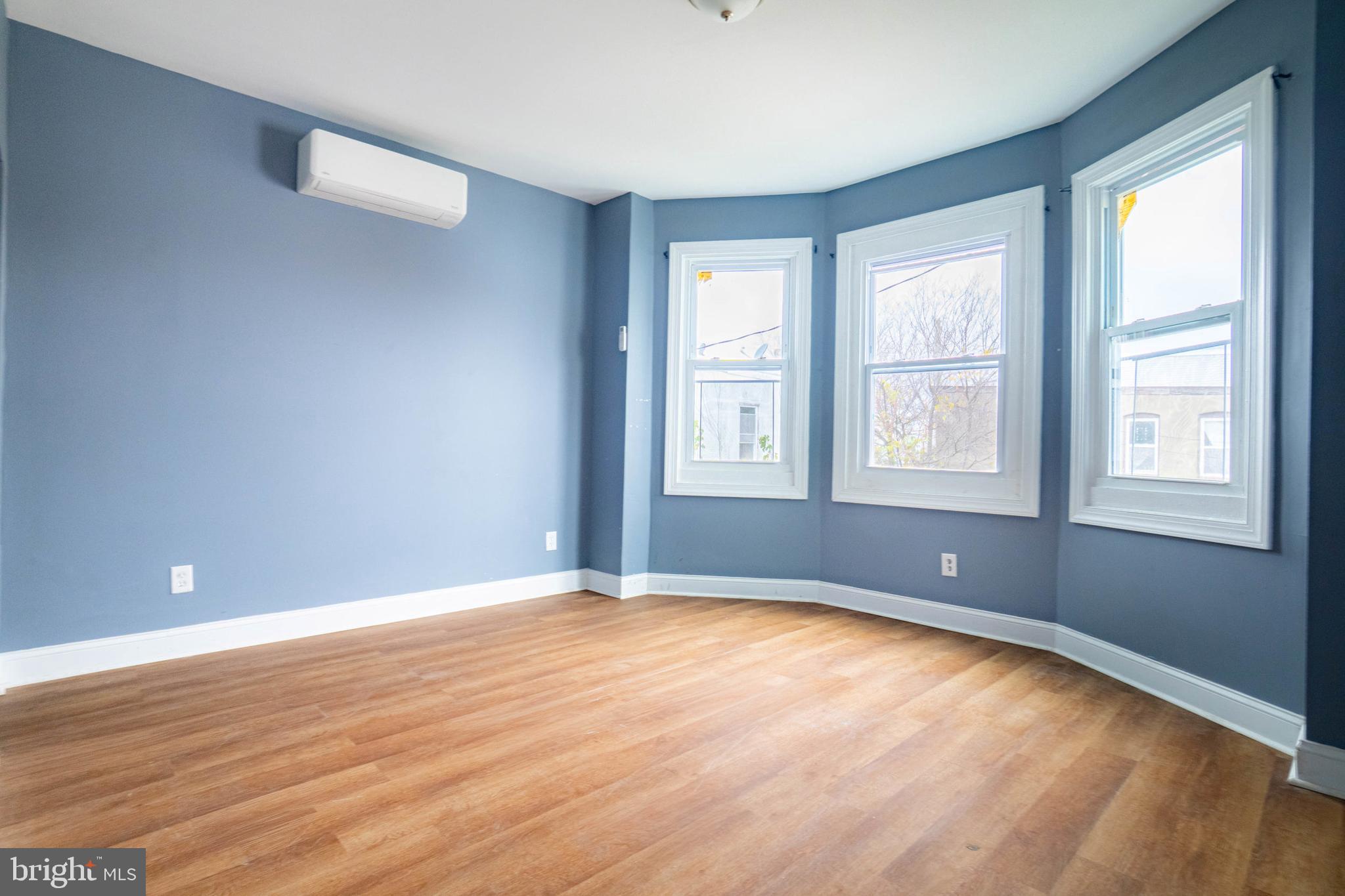 2506 Tindaro Terrace Atlantic City, NJ 08401 - Photo 7 of 14 a view of an empty room with wooden floor and a window