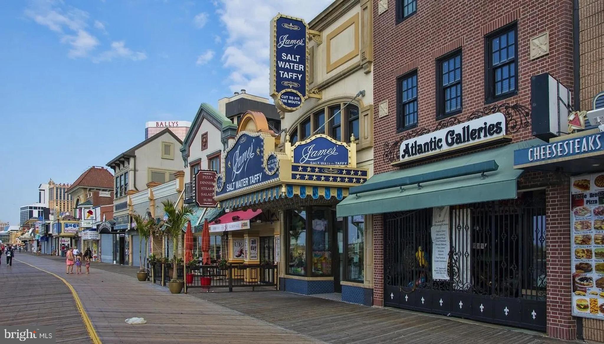 2506 Tindaro Terrace Atlantic City, NJ 08401 - Photo 10 of 14 a view of a building with a retail shops and a people on a street