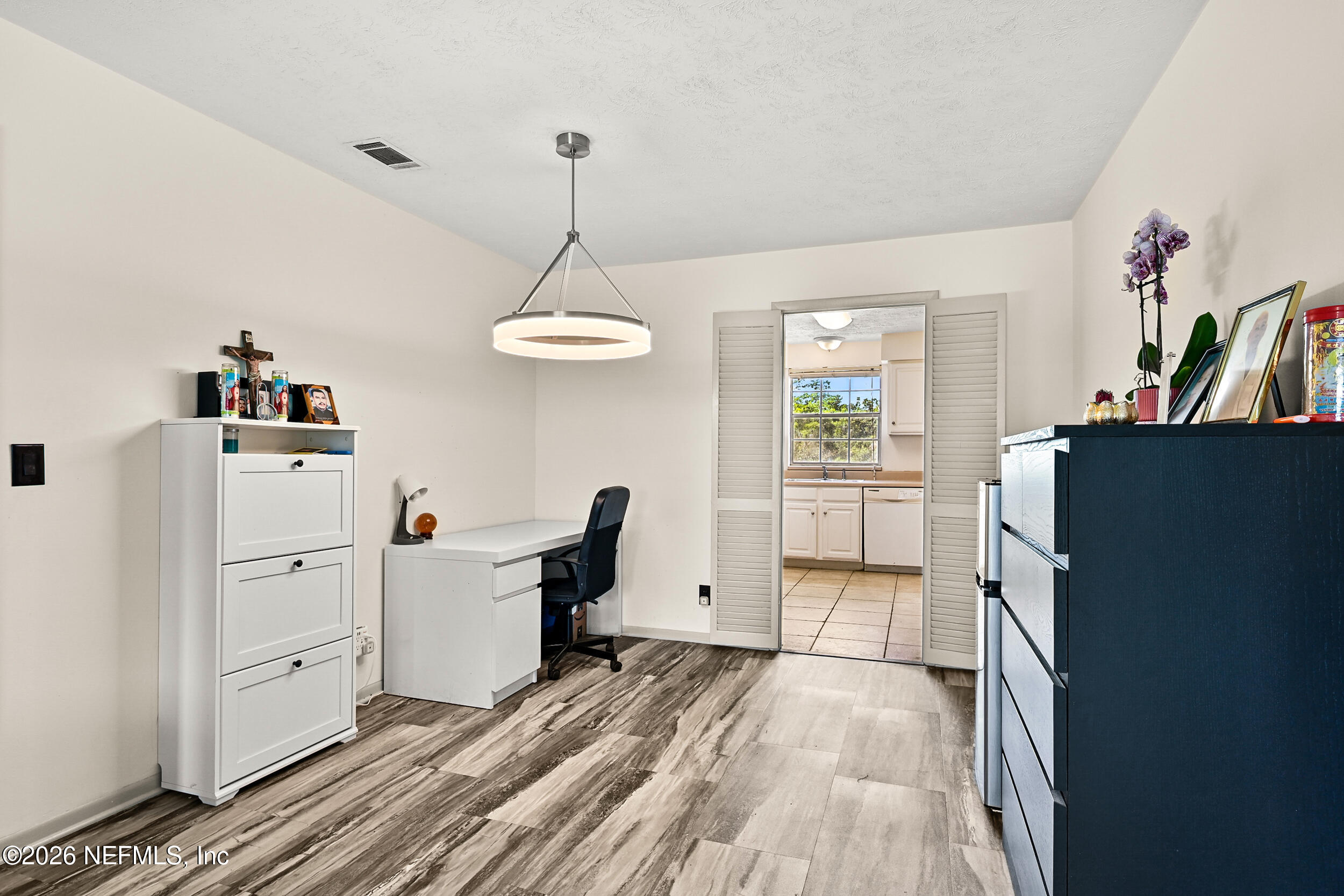 4915 Baymeadows Road, Unit 6G Jacksonville, FL 32217 - Photo 10 of 44 a view of a workspace with furniture and a window