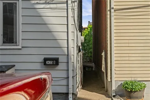 a view of a door and chair in the patio