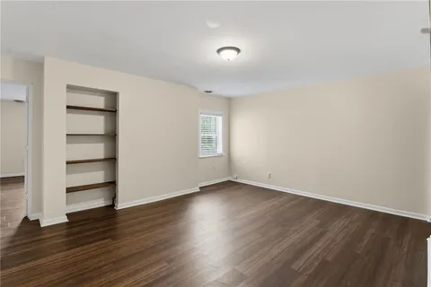 a view of wooden floor and windows in a room