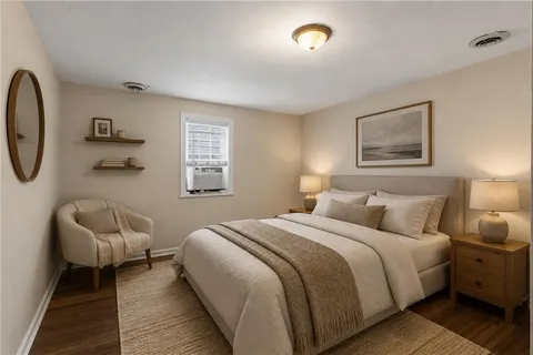 a bedroom with bed and a couch