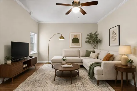 a living room with furniture and a flat screen tv