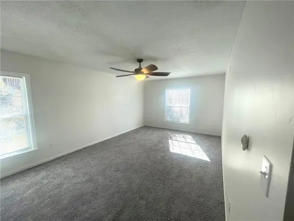 a view of empty room with windows