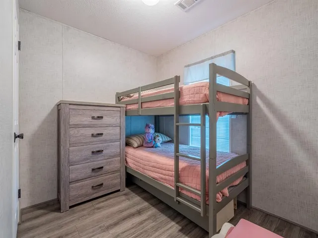 a view of walk in closet with clothes