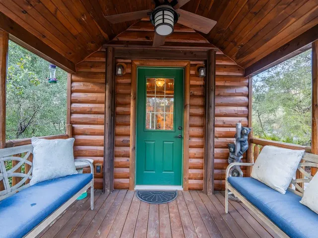 a view of a chair and table in the balcony