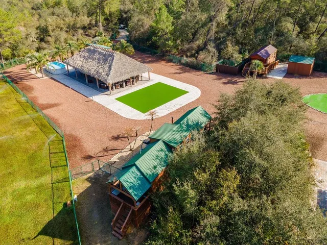 a view of a wooden deck with a yard