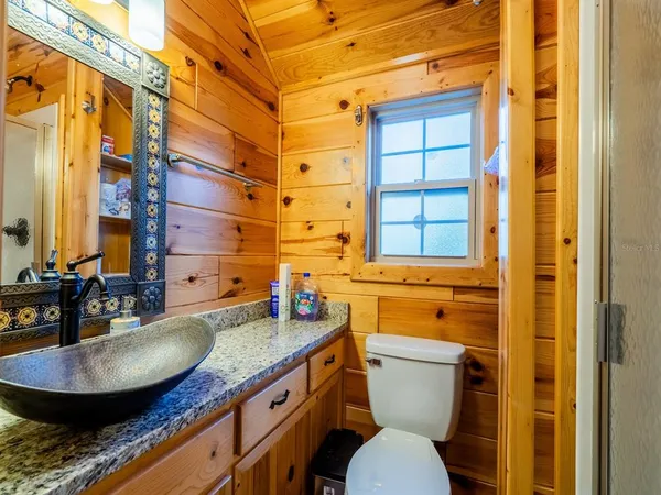 a view of a chair and tables in the backyard