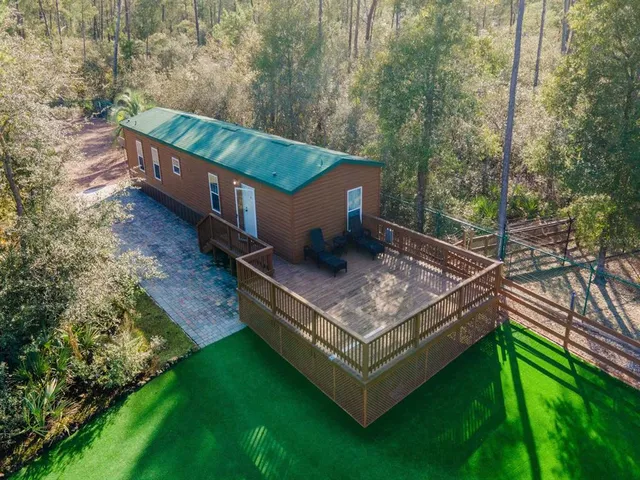 a kitchen with stainless steel appliances granite countertop a stove and cabinets
