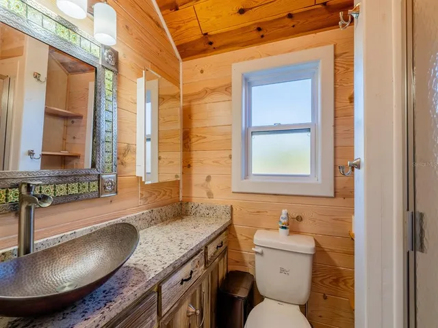a kitchen with stainless steel appliances granite countertop a refrigerator and a stove