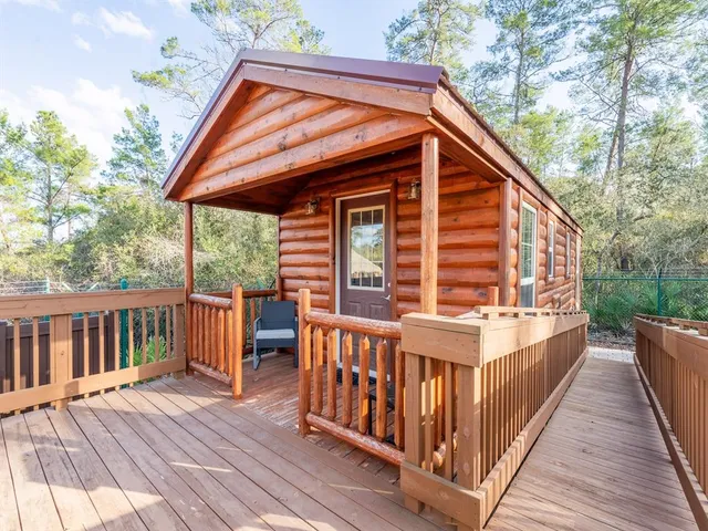 a view of a lake with couches chairs and city view