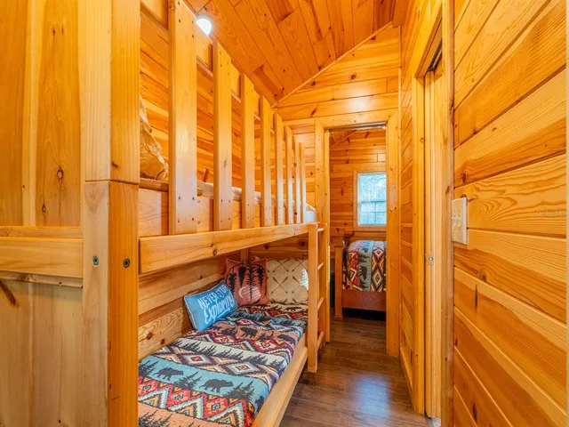 a view of a house with backyard porch and sitting area