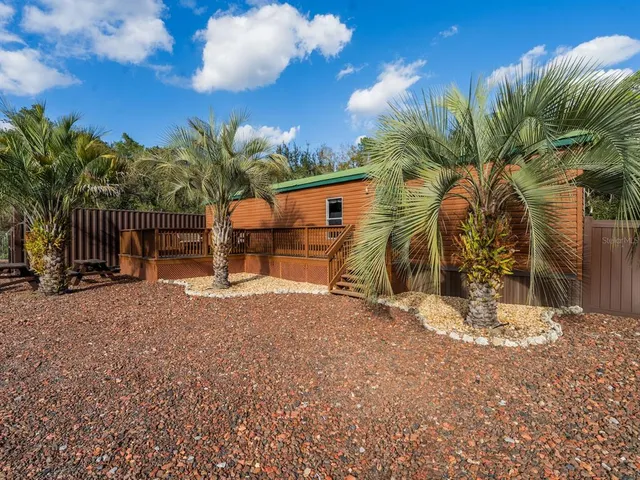 a view of a swimming pool with outdoor seating