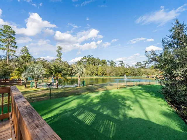 a bedroom with a bed and a television
