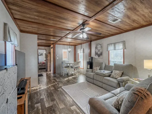 a bathroom with a sink a mirror and a shower