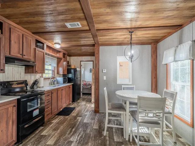 a bedroom with a bed and a baby crib